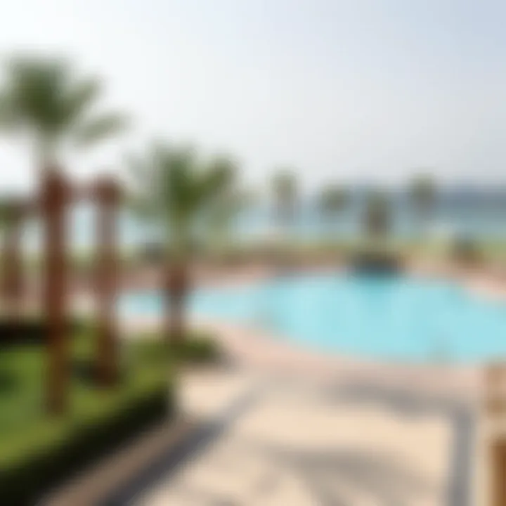 Amenities Overview: Pool and Garden at Khorfakkan Hotel Panoramic view of the hotel's amenities including the pool and garden